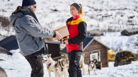 parcel being delivered on snowy mountain