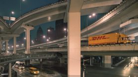 DHL truck crossing bridge