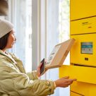 customer collecting parcel from container