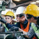 employees being shown how to do a task safely