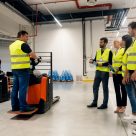 man teaching others how to use a forklift