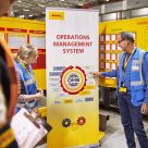 employees being taught with DHL posters and infographics