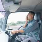 tired man driving a truck