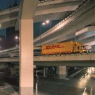 DHL truck crossing bridge