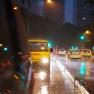 DHL van in traffic in the rain