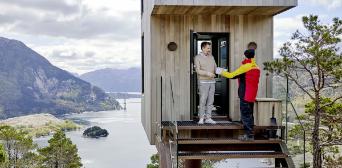 Man receives a parcel in his holiday home