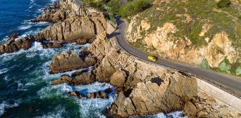 DHL car on coastal road