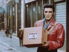 Elvis with a parcel