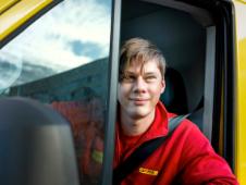 Christian Digby behind the wheel of his van