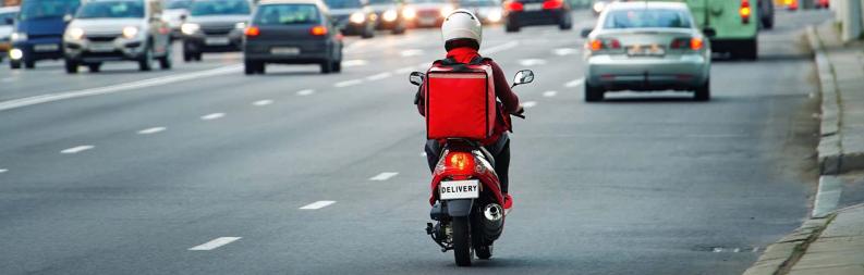 Courier on a moped