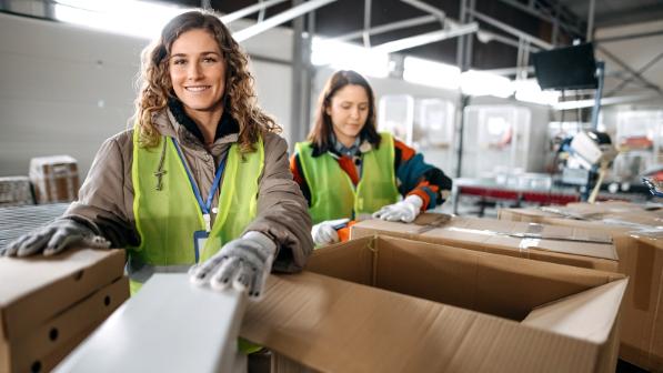 Employees sort old clothes