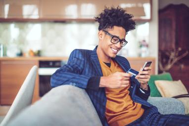 Man completes an online order on his cell phone