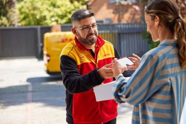 DHL courier delivers a parcel