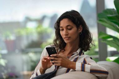 Woman shops on her smartphone