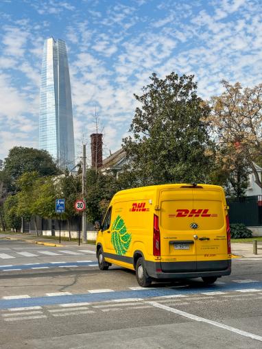 DHL van in front of the Gran Torre Santiago