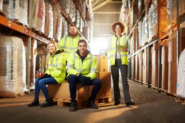 Employees in yellow high-visibility jackets