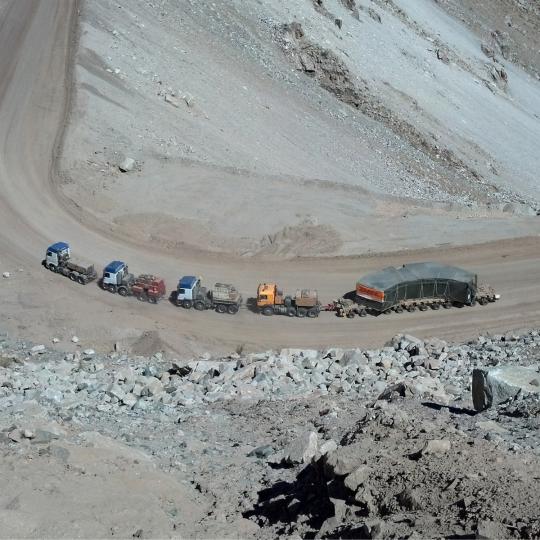 Bird's eye view DHL Industrial Projects trucks at a mine