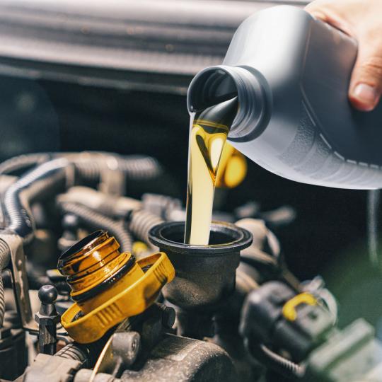 Oil being added to a car engine