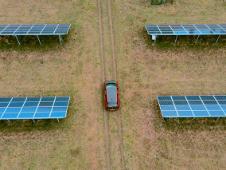 Electric car between solar panels