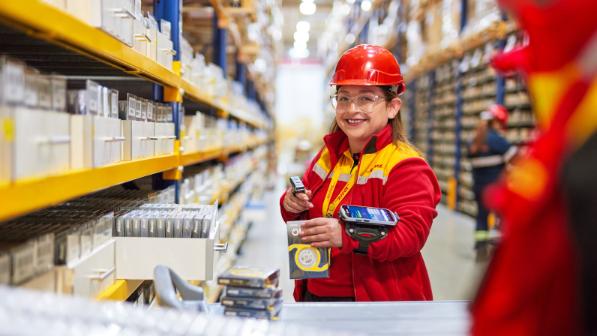 smiling woman in a warehouse