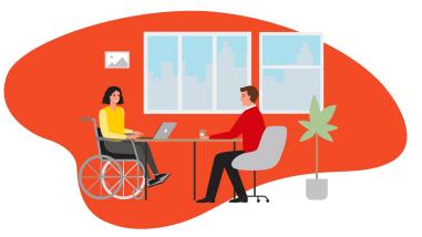 Woman with disabilities and man in a meeting setting.