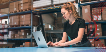 Business manager checking stock levels in a warehouse