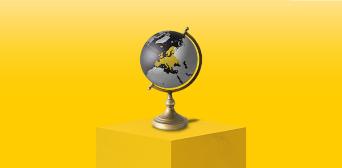 An image of a globe standing on a plinth