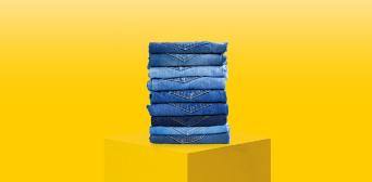 A stack of jeans on a plinth