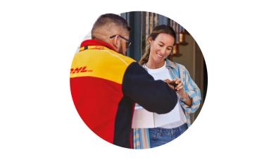 dhl driver handing a parcel to a woman a her door