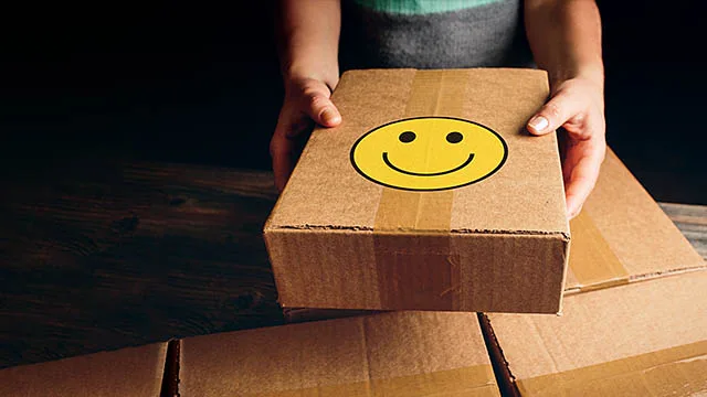 Hand holding brown package