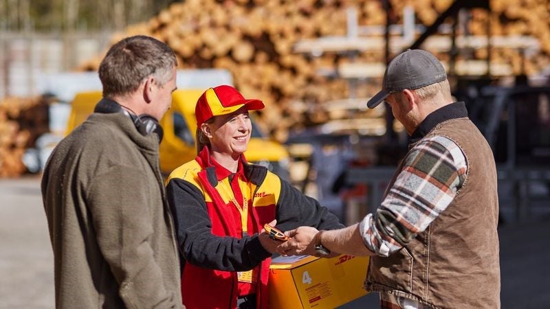 dhl express employee delivering shipment