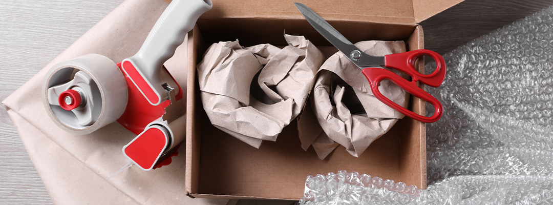 items being packaged in a brown box