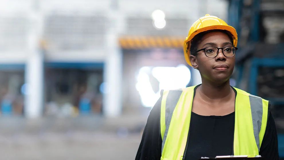 woman in a high vis and hard hat