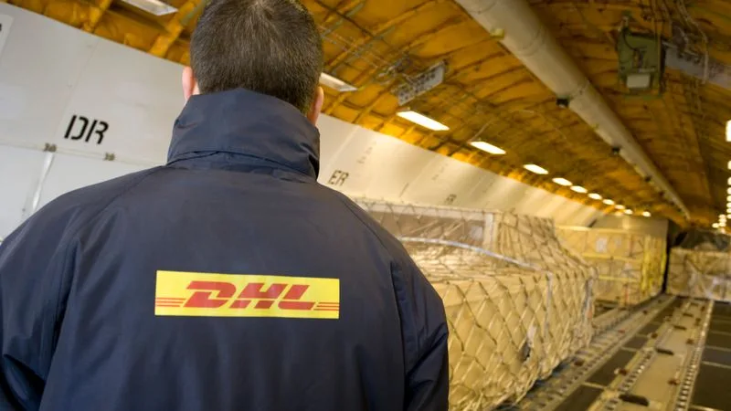 dhl employees preparing for semiconductor shipping