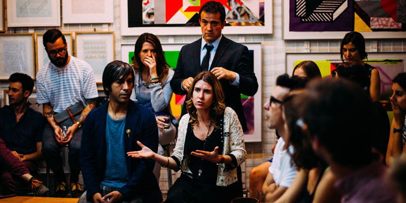 woman speaking to a group of people