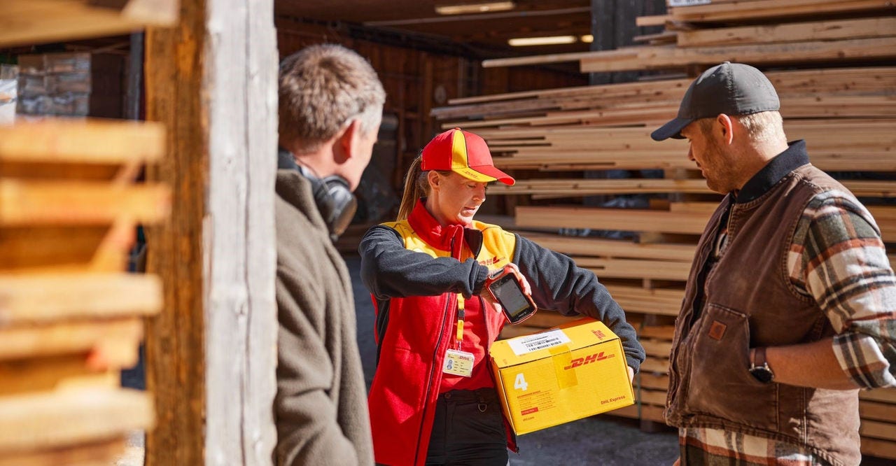 dhl express employee picking up package to be exported to china