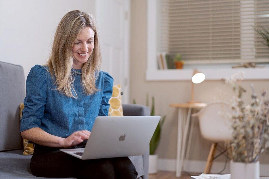 Woman using laptop at home