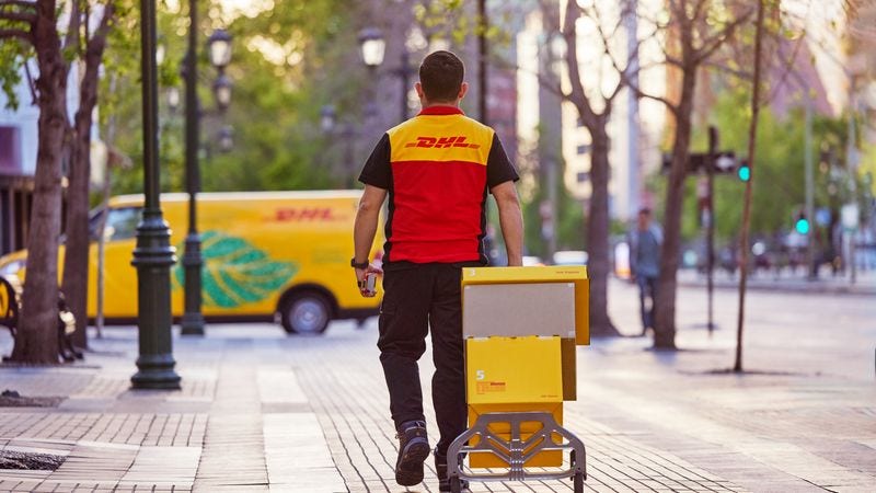 a dhl courier providing package delivery services in indonesia