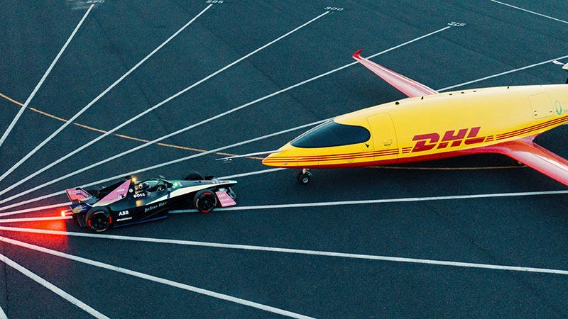 DHL airplane and formula e vehicle facing each other