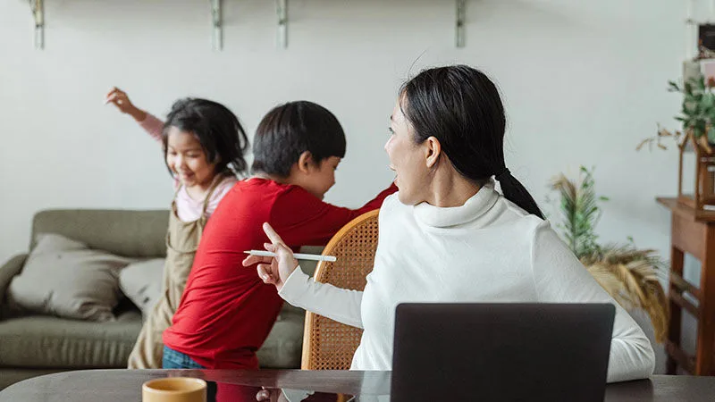 woman with children playing