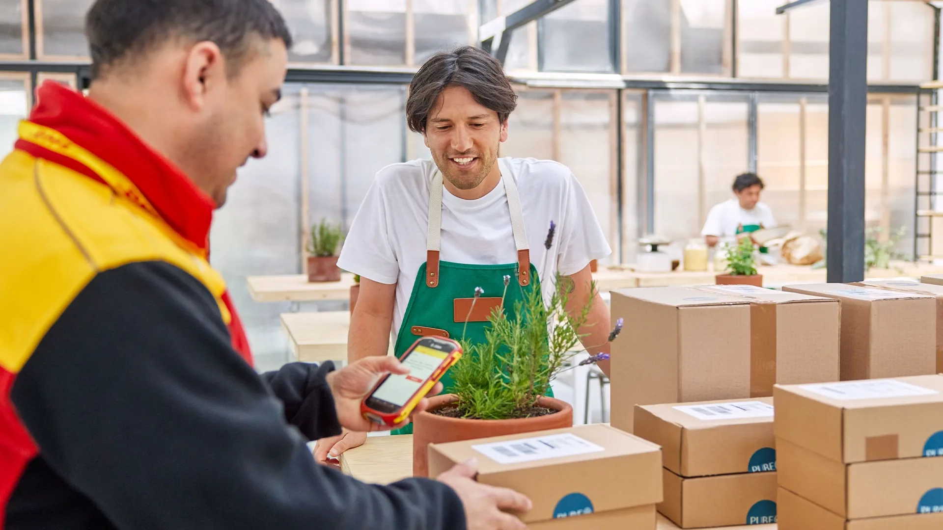 DHL courier  scanning a parcel
