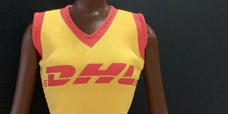 Malaville doll wearing DHL vest