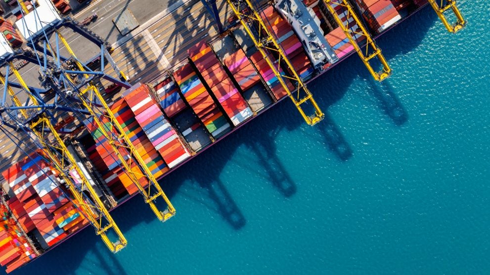 an aerial view of cargo containers on the port