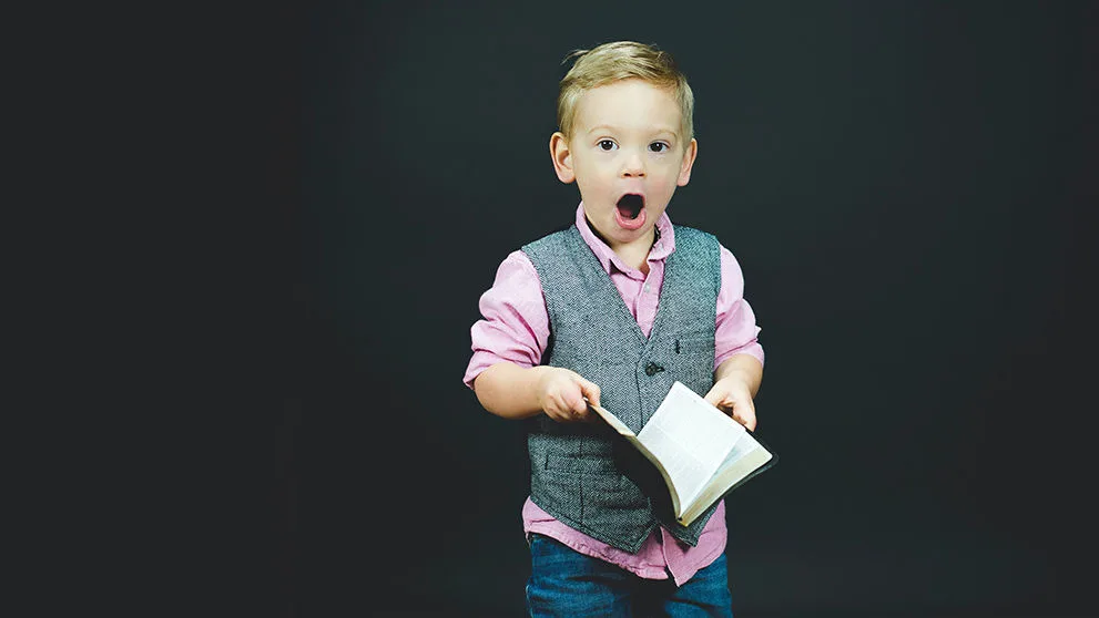 little boy with mouth open