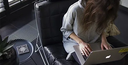 woman typing on laptop