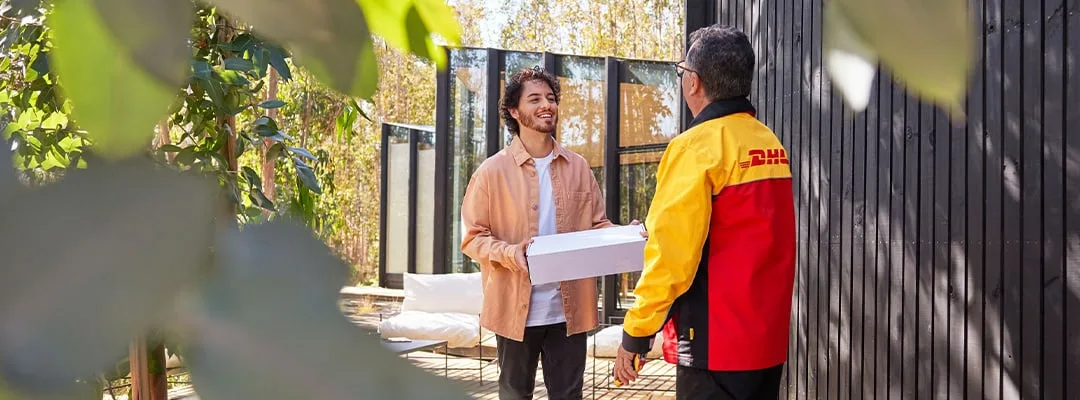 DHL courier delivering a package