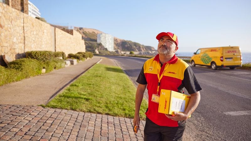 dhl express employee delivering parcel