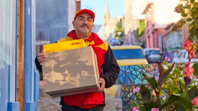 dhl employee delivering parcels after shipping from thailand