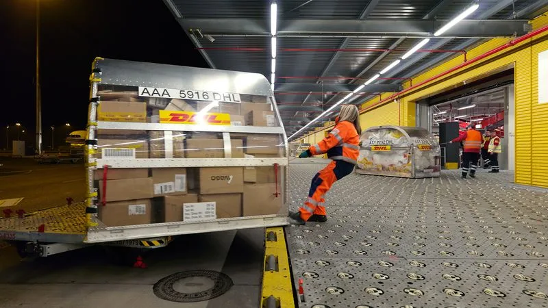 dhl workers transferring canned fish from thailand