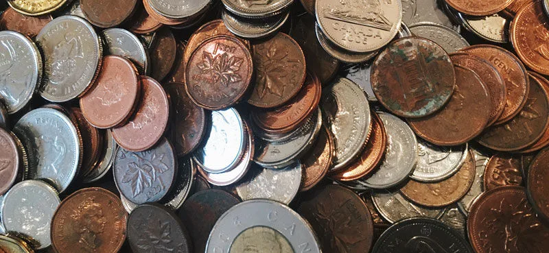 Pile of coins in different currencies